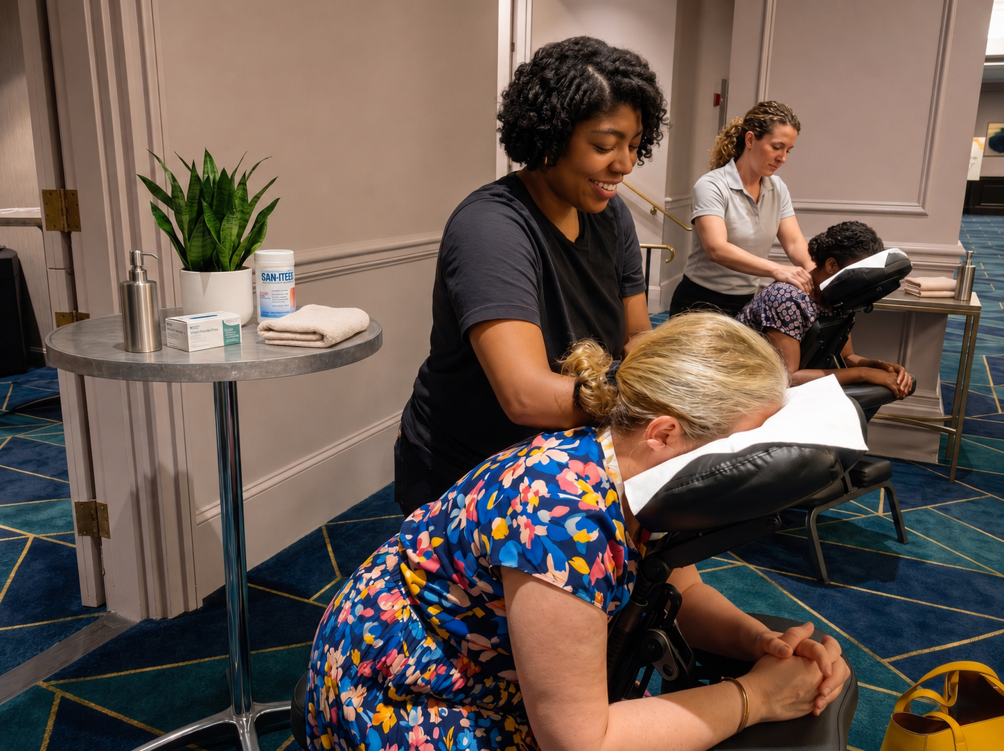 Onsite chair massage therapist working at a Las Vegas, NV corporate conference