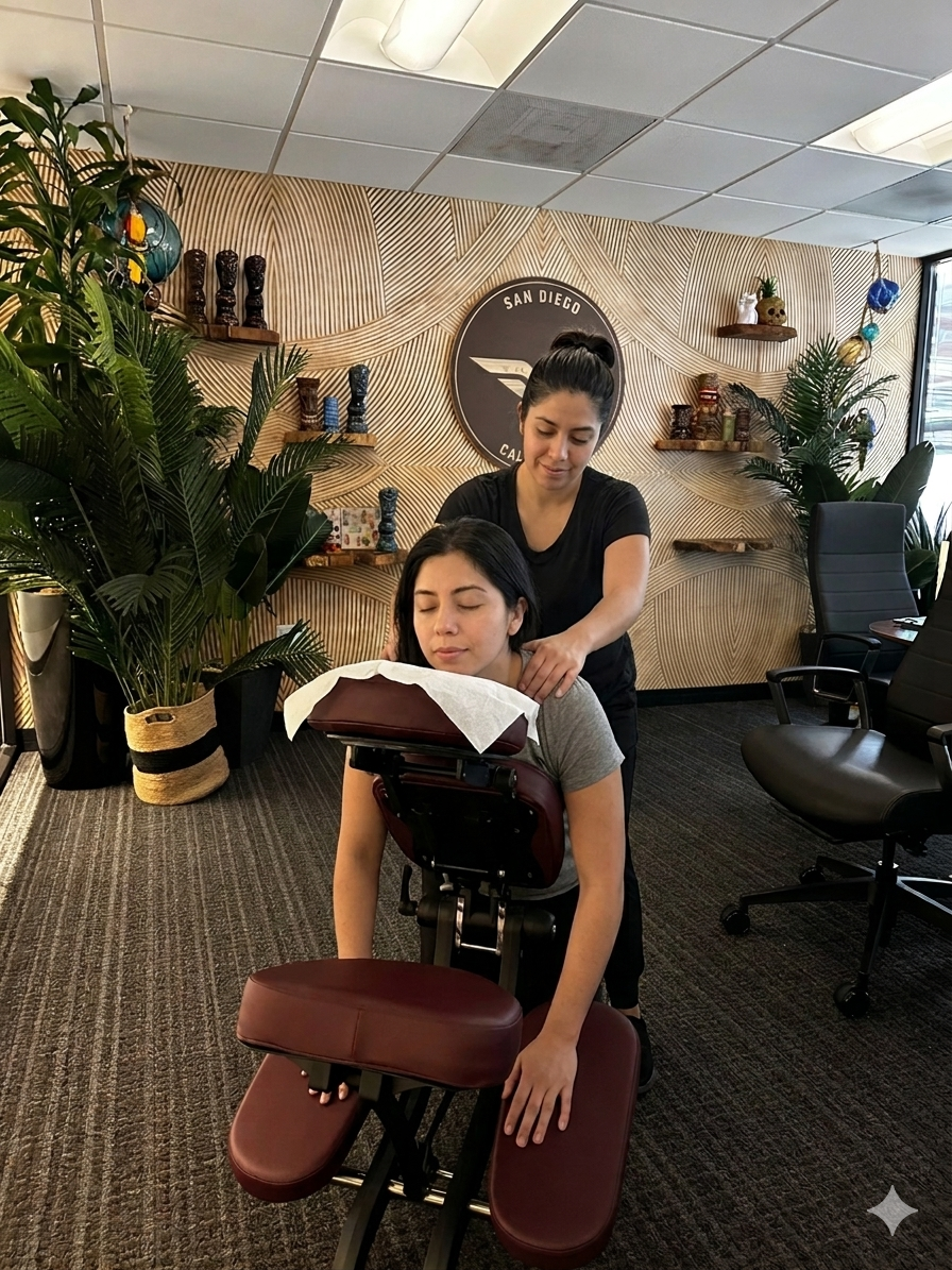 Massage by Design massage therapist providing onsite chair massage at a San Diego corporate conference event