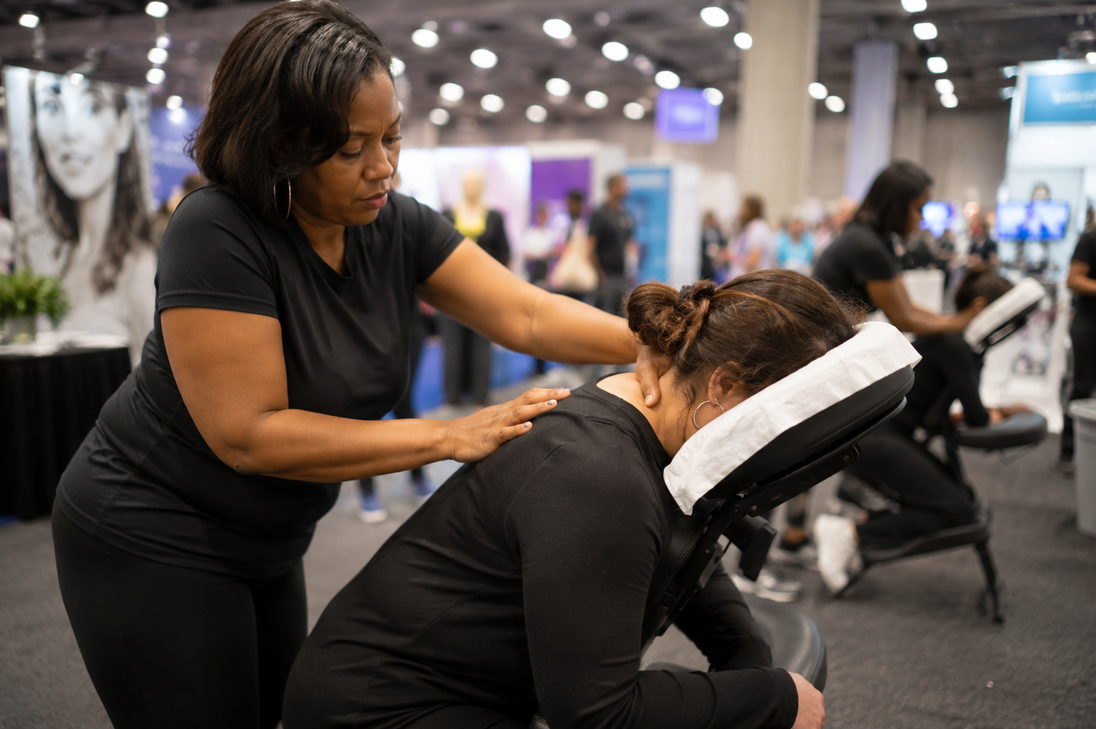 Chair massage wellness lounge at a multi-day conference
