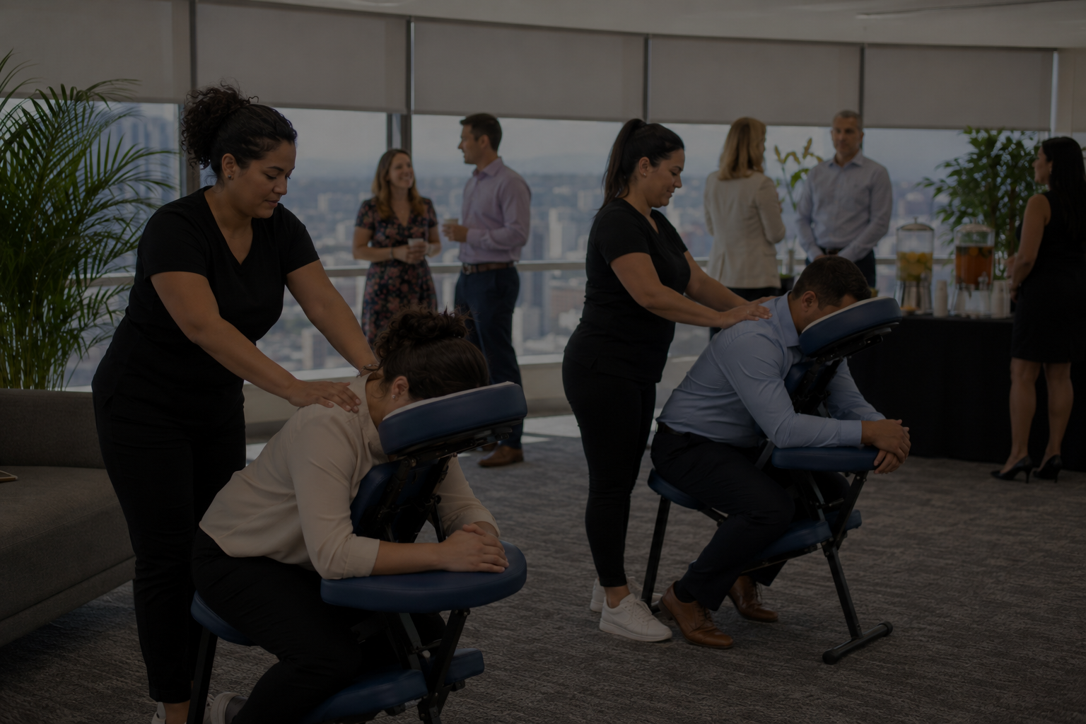 Onsite employee appreciation chair massage event with corporate guests in a professional office setting